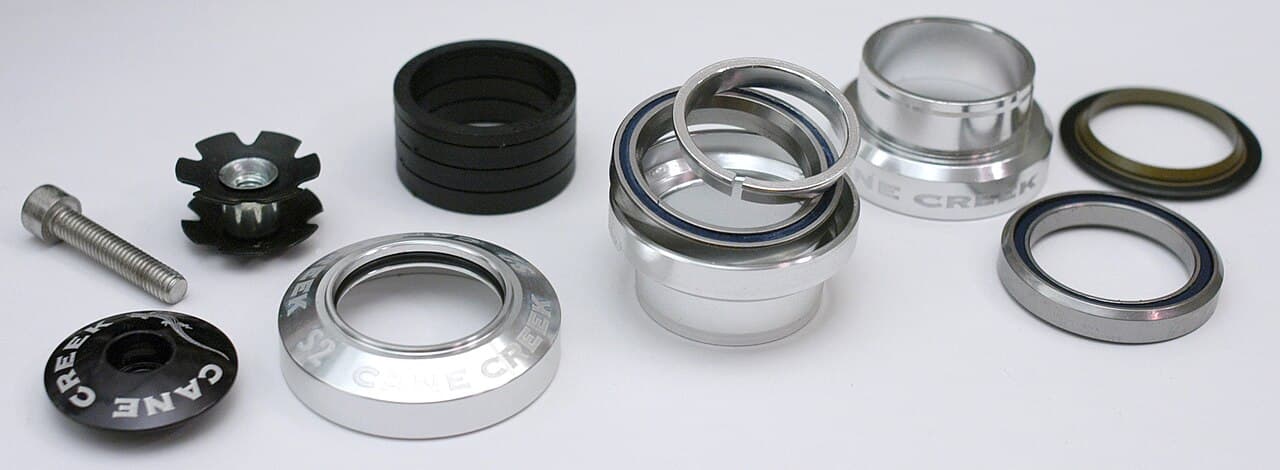 Disassembled parts of a threadless cartridge bicycle headset