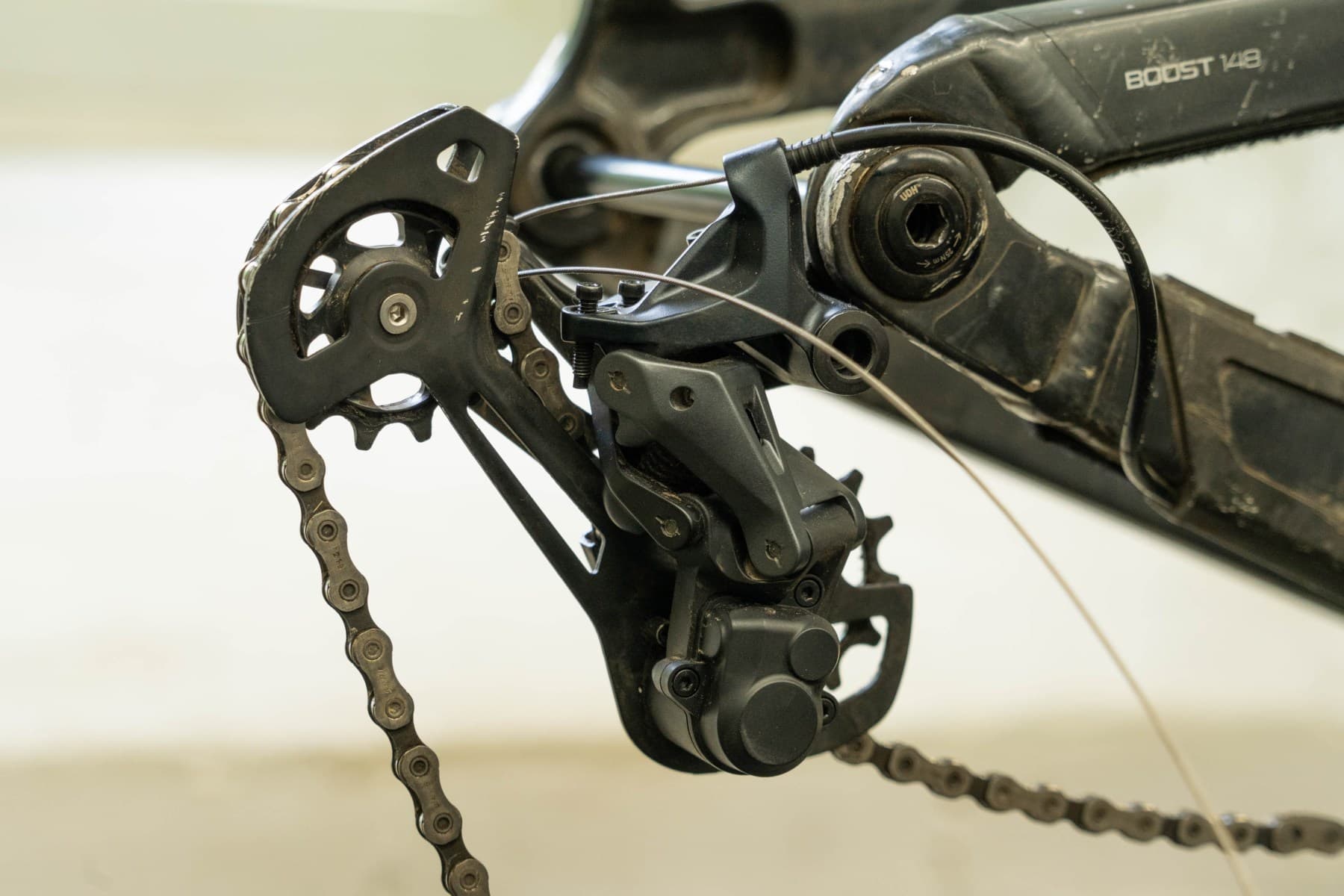 Close view of a mountain-bike rear derailleur and chain